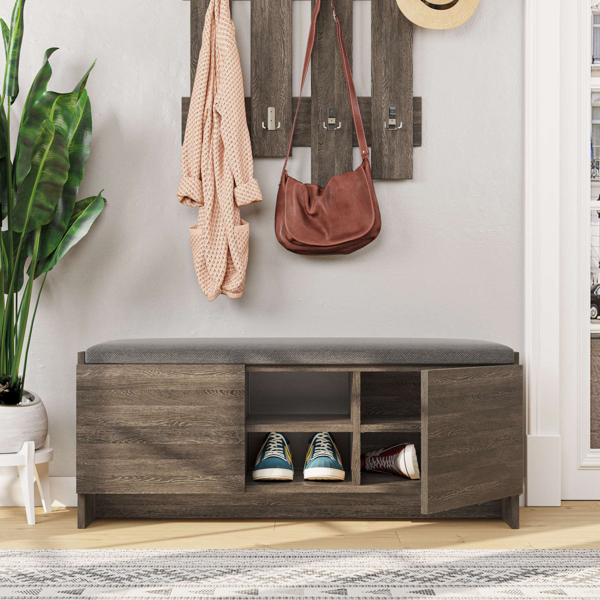Padded hallway bench with storage compartments and shoe shelf, perfect for entrance seating and shoe organisation.