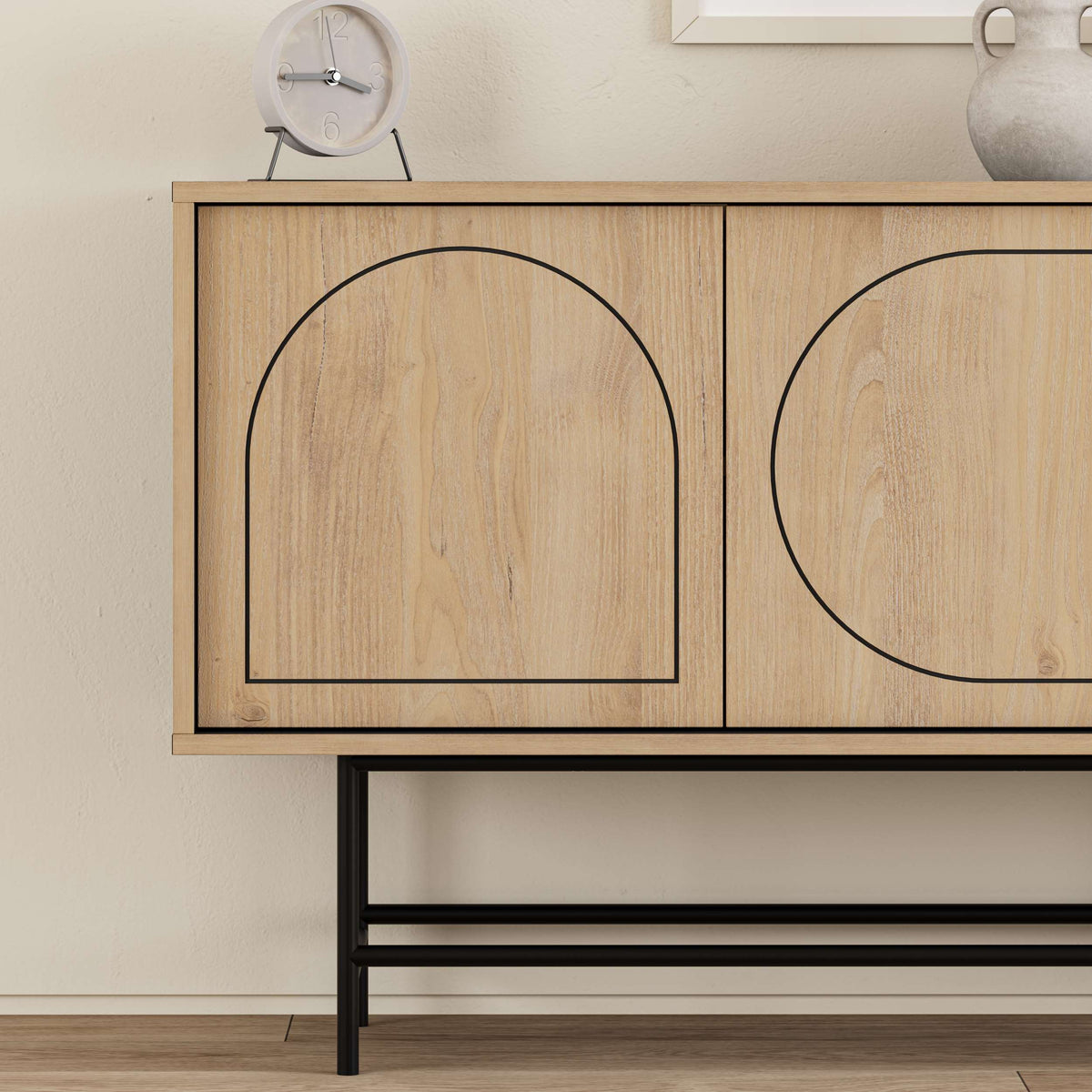 Modern oak-effect sideboard with black metal base and arched door detailing, ideal for living or dining room storage.