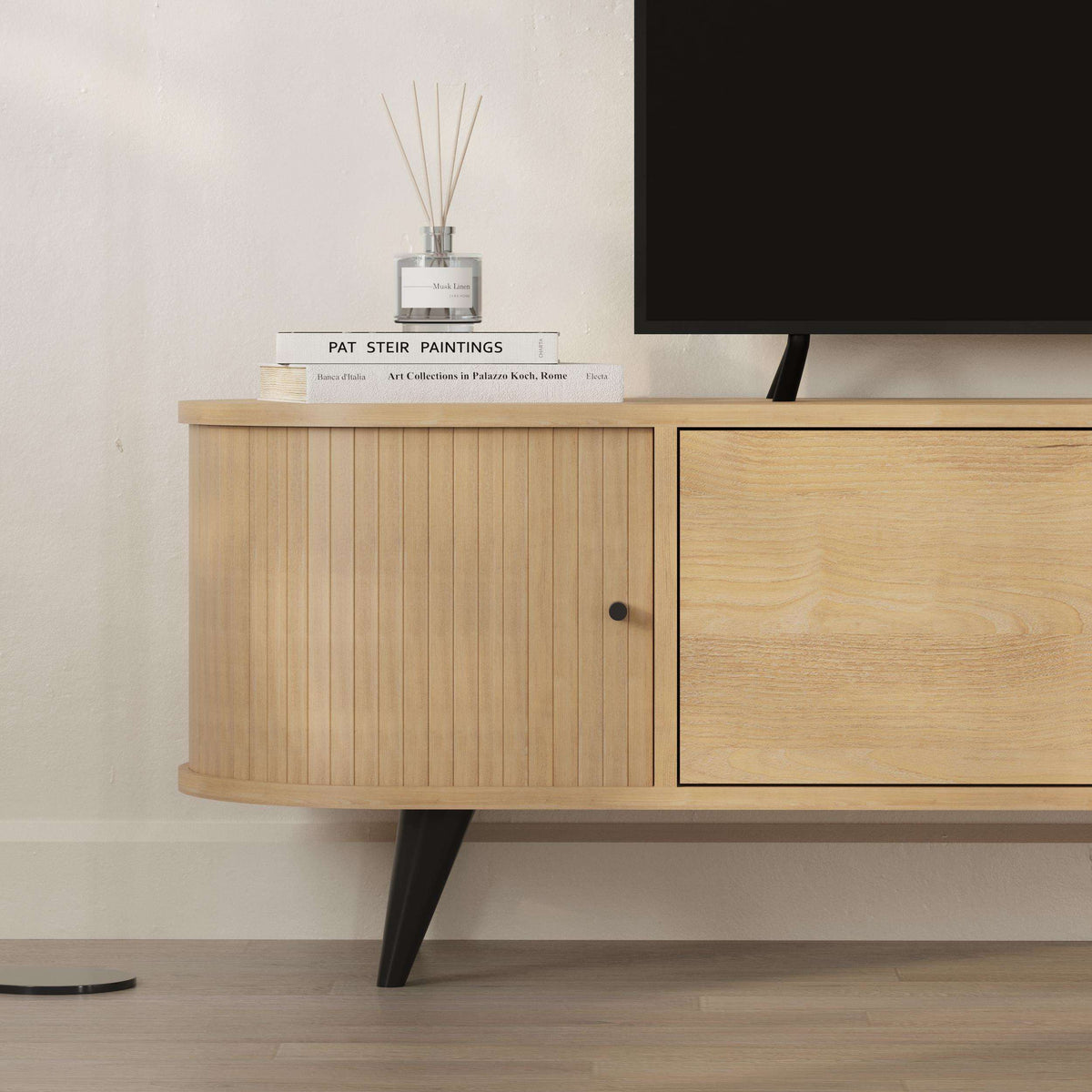 Oak-effect TV unit with curved sides, three-door storage, and tapered legs for modern living rooms.