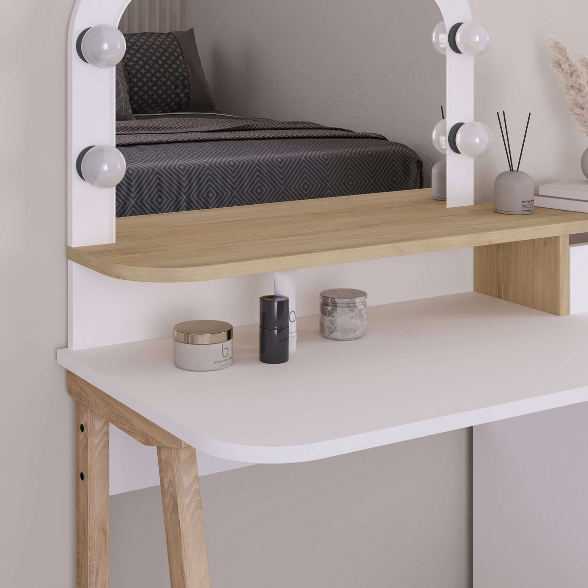 Vanity table with Hollywood-style mirror, storage drawers and upper shelf, ideal for makeup and daily grooming routines.