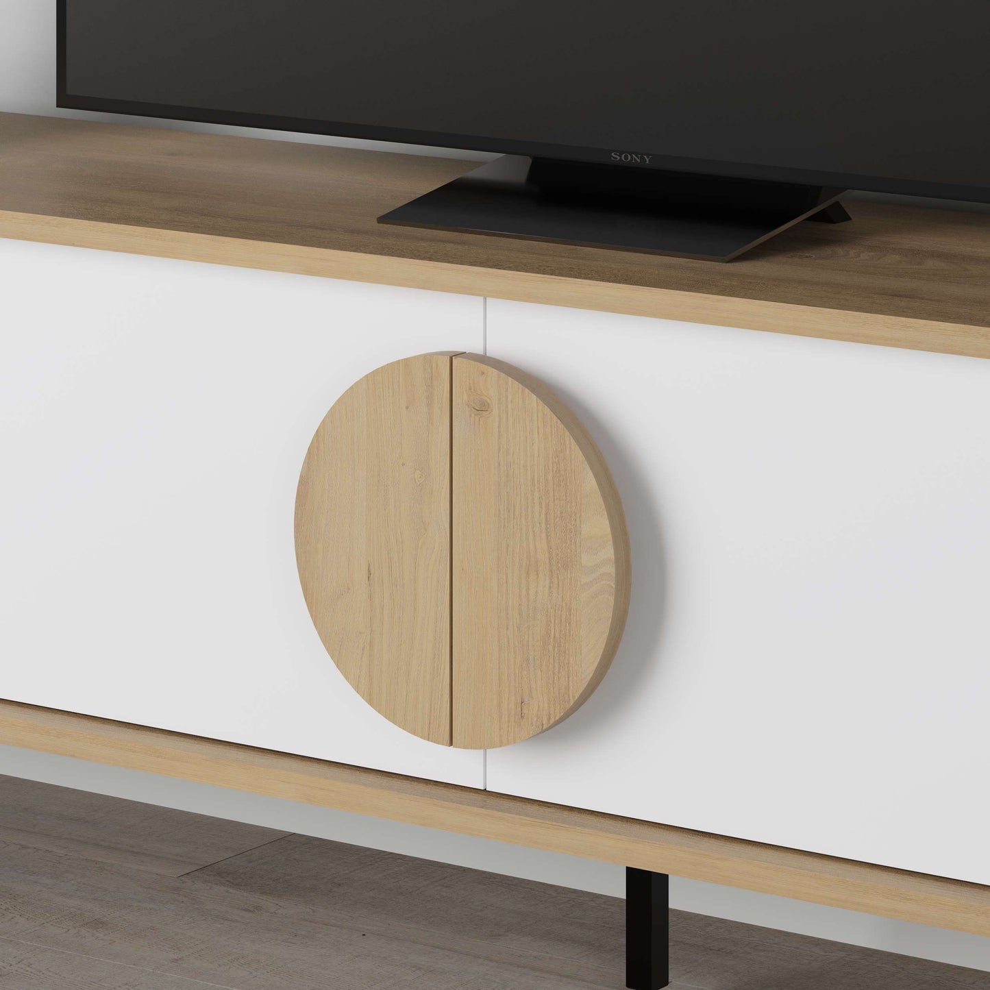 Scandinavian-style TV unit with black doors, round centre detail, ideal for modern media storage.