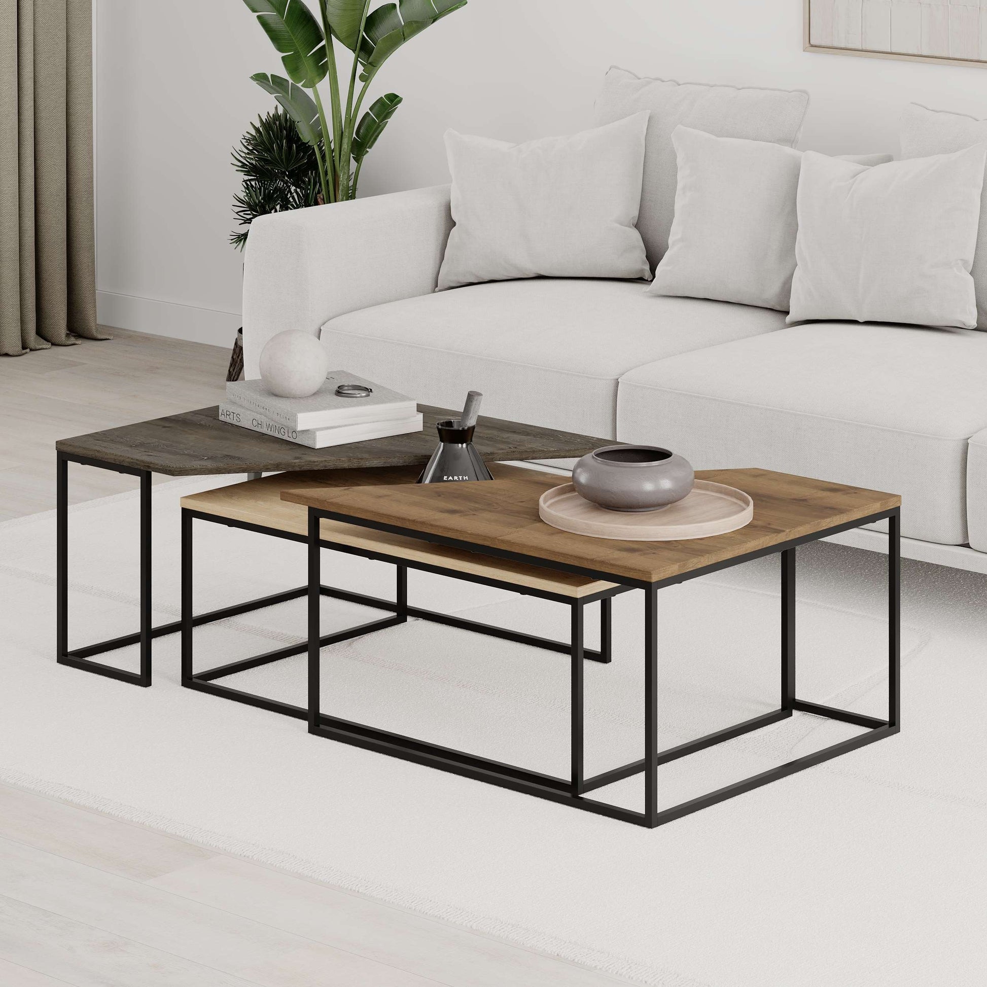 3-piece nesting coffee table set with geometric tops and metal frames, perfect for flexible and space-saving living room use.