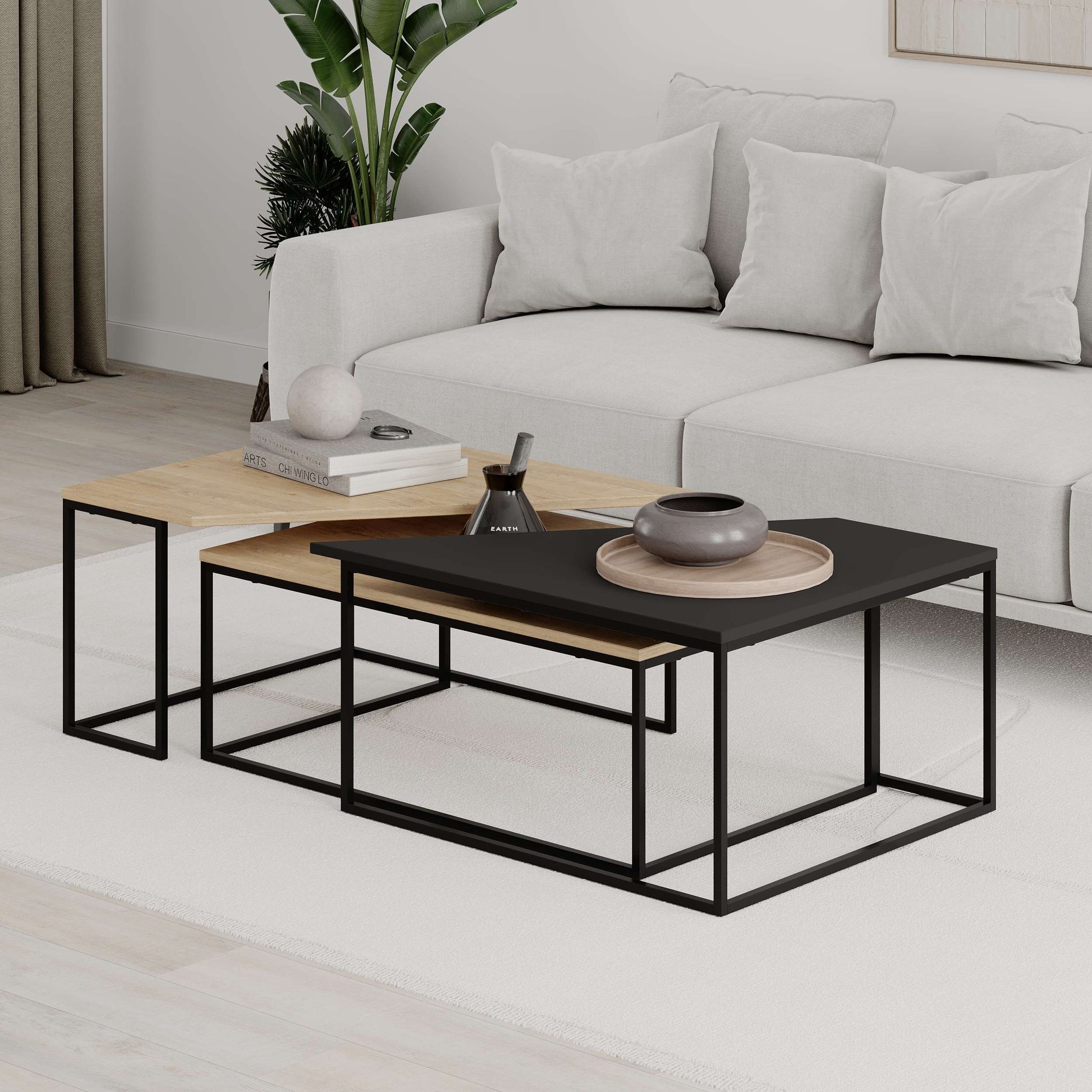 3-piece nesting coffee table set with geometric tops and metal frames, perfect for flexible and space-saving living room use.