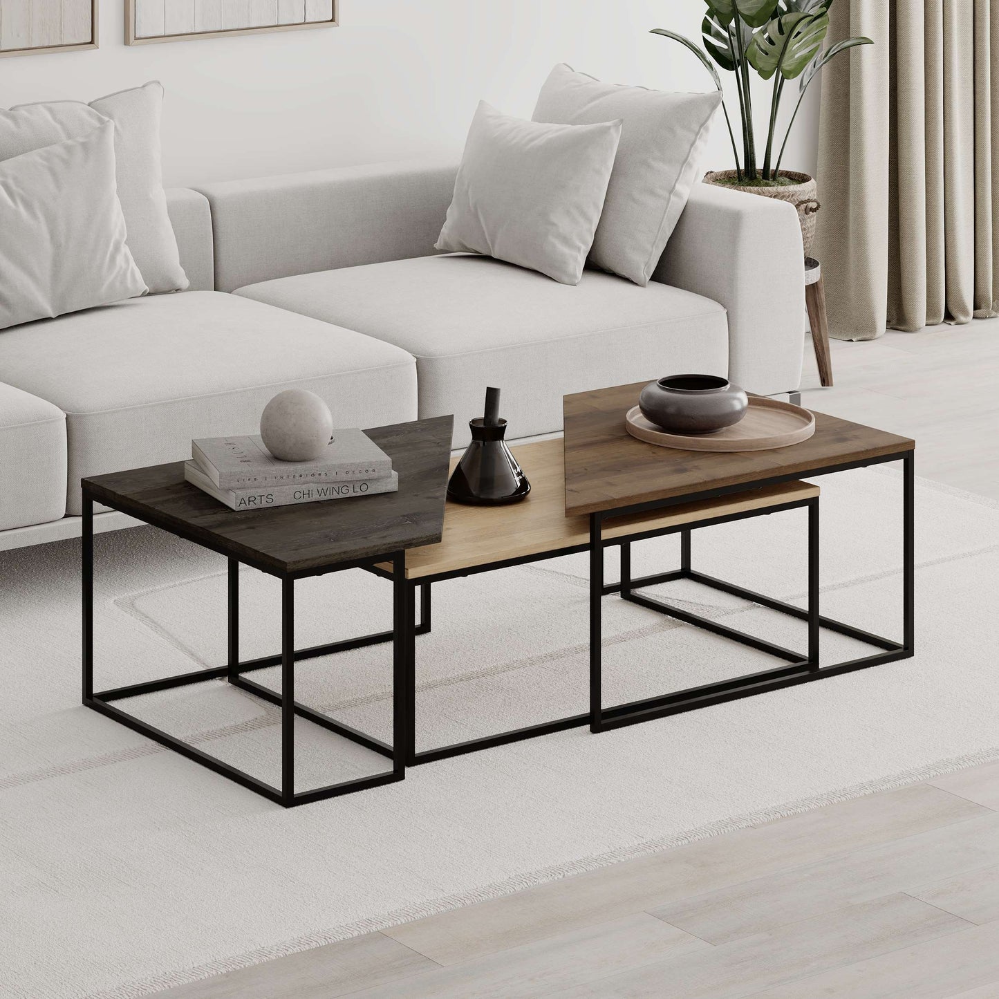 3-piece nesting coffee table set with geometric tops and metal frames, perfect for flexible and space-saving living room use.