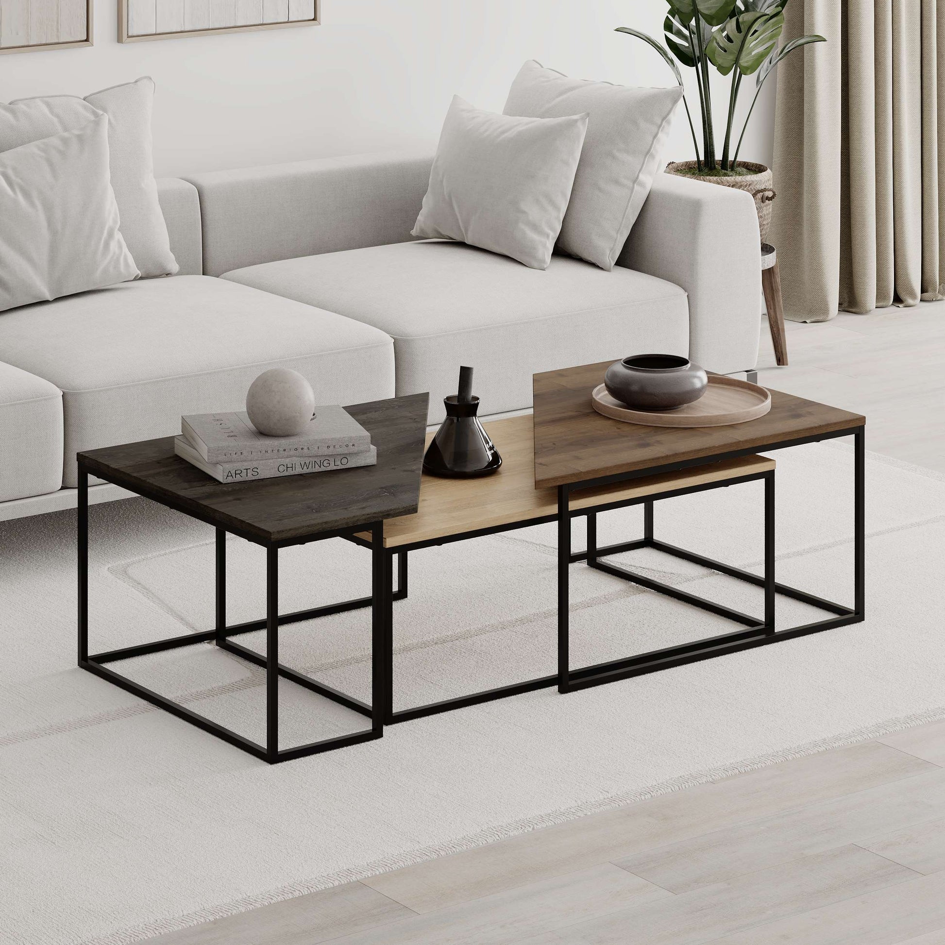 3-piece nesting coffee table set with geometric tops and metal frames, perfect for flexible and space-saving living room use.