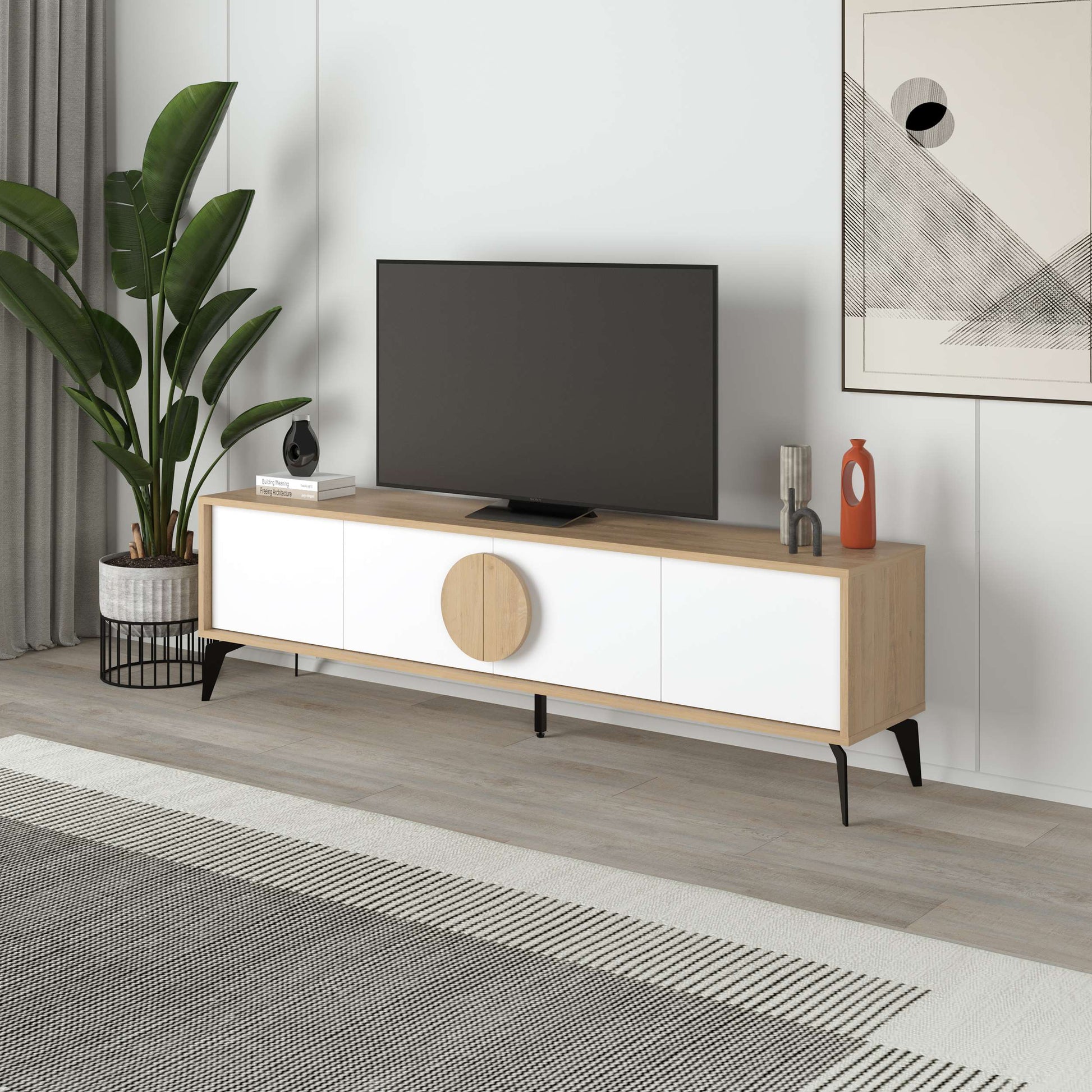 Scandinavian-style TV unit with black doors, round centre detail, ideal for modern media storage.