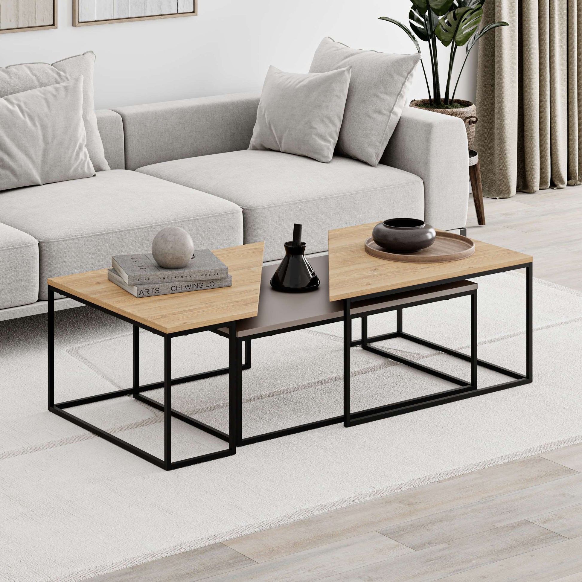 3-piece nesting coffee table set with geometric tops and metal frames, perfect for flexible and space-saving living room use.