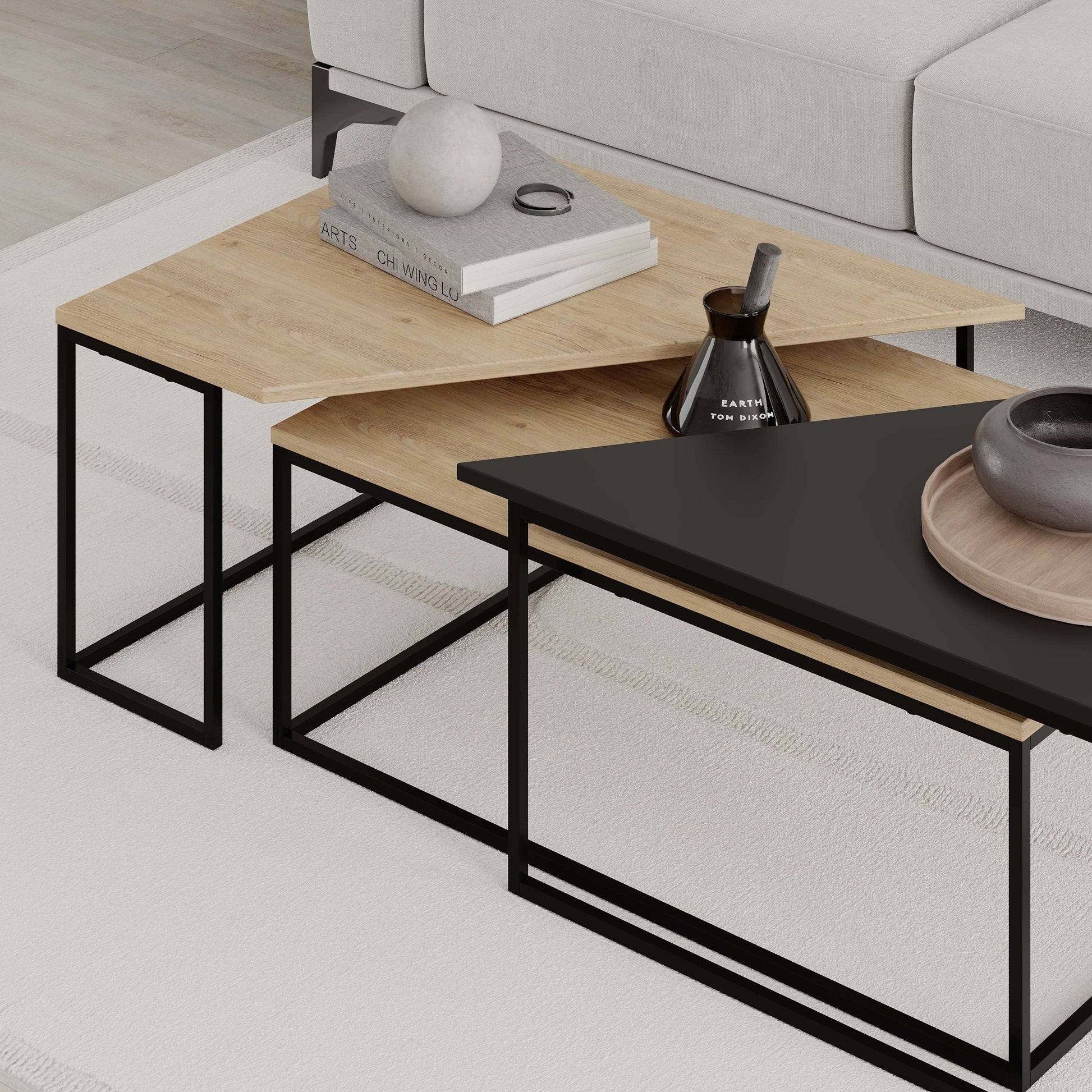 3-piece nesting coffee table set with geometric tops and metal frames, perfect for flexible and space-saving living room use.